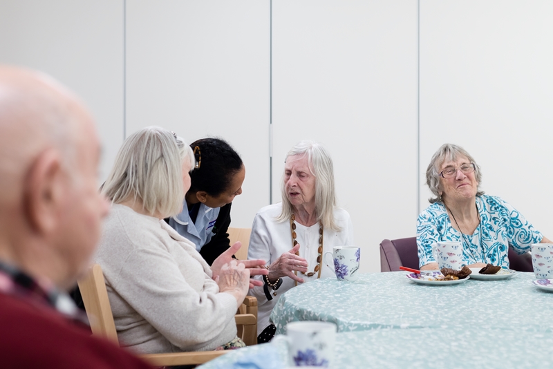 Brooke Mead Cohousing Brighton residents around a table