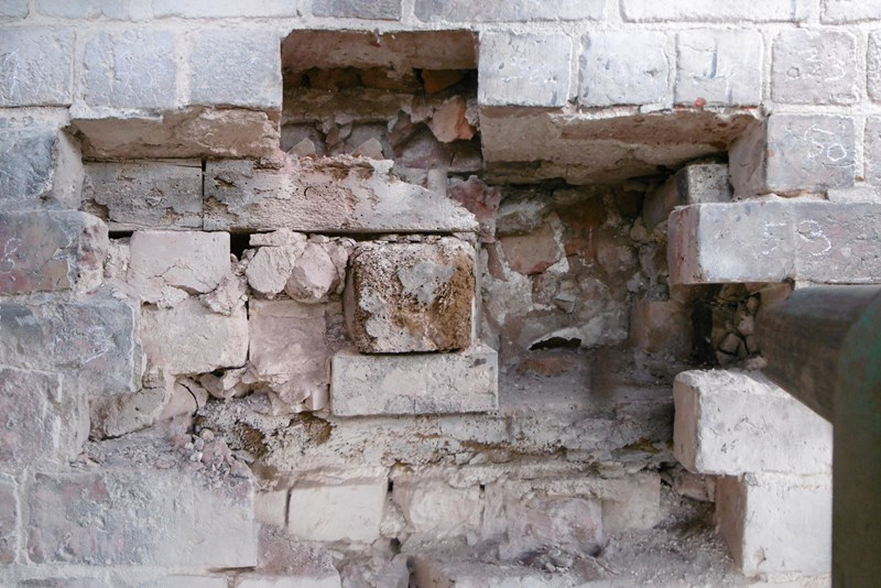 Embedded structural timber within the wall