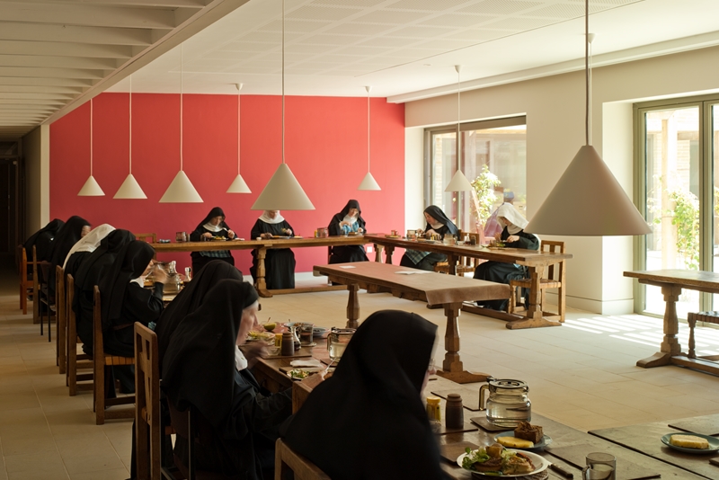 Nuns eating in dining room