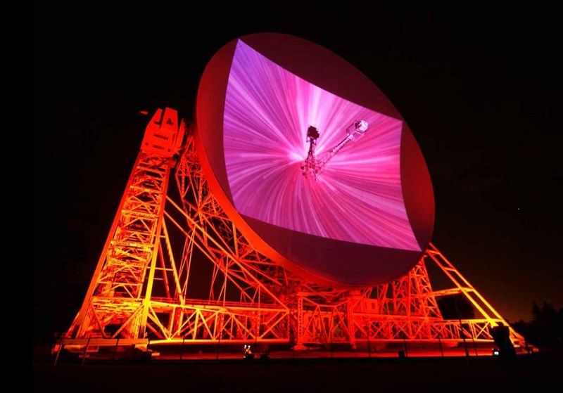 The Lovell Telescope at Jodrell Bank,  during a sound and light performance piece by Jem Finer and Ansuman Biswas