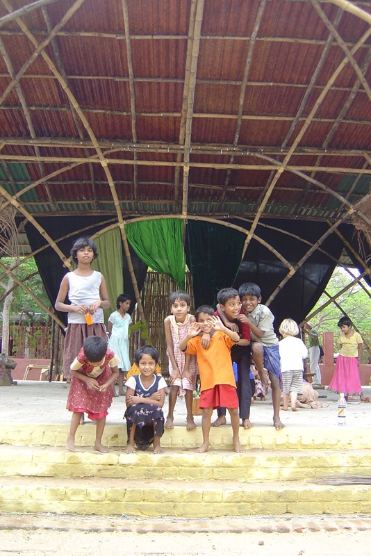 Children performing on bamboo stage